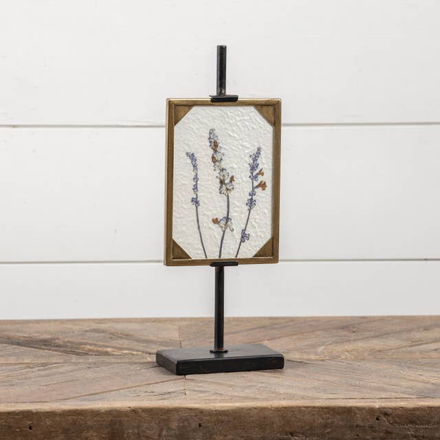 Aida 13.5" framed pressed flowers art in gold frame on black stand sitting on wood countertop | Tabletop Decor | Hugo George Home